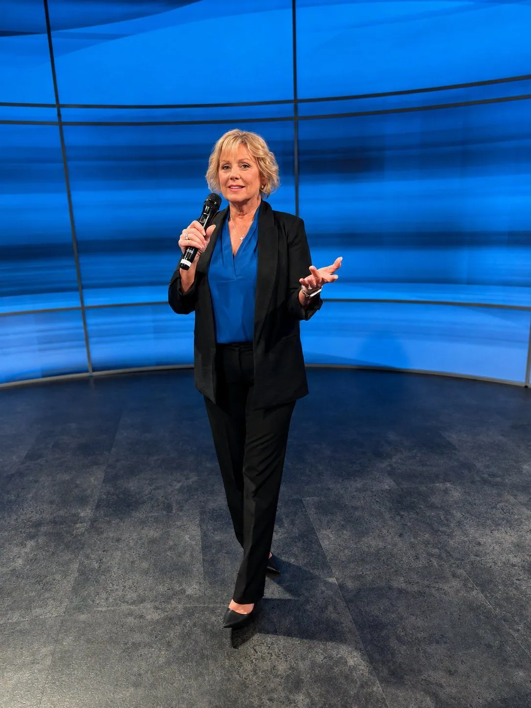Ann Carden speaking on stage