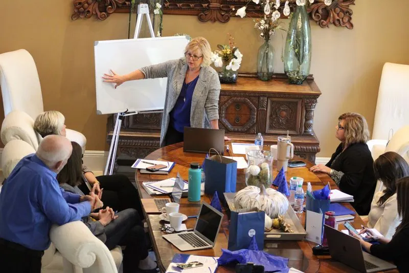 Ann leading a strategy session at a private luxury retreat