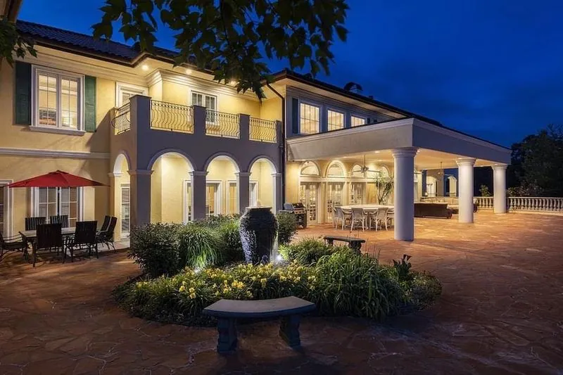 The retreat estate lit up at dusk